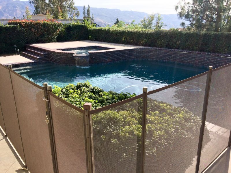 Pool Area with Mesh Safety Fence